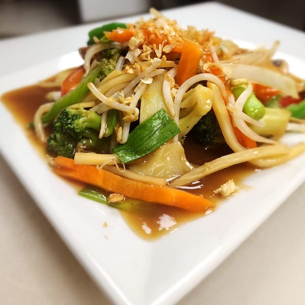 Thai House Bistro's stir-fried mixed vegetables with carrots, broccoli, and bean sprouts in sauce.